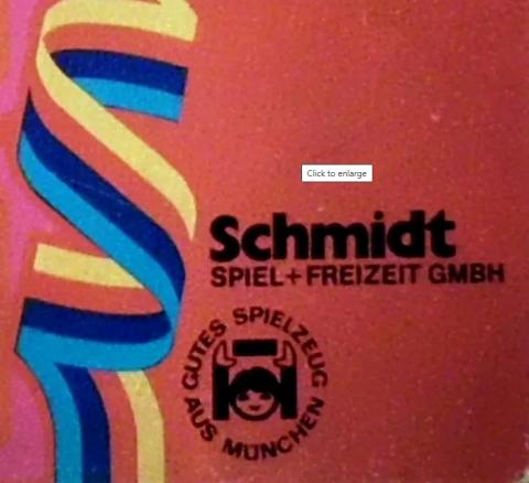 Band in Blau-lila-rot-gelb, ein teil wie s geschlungen, daneben Schmidt SPIEL + FREIZEIT GMBH, auch mit SCM003 daneben