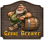 Game Brewer in wappenähnlichem Rahmen unter bärtigem Zwerg, der seitwärts an einem Fass lehnt